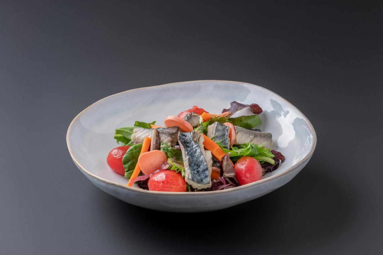 Eurostars Portico Alicante Exterior foto A salad with sardines