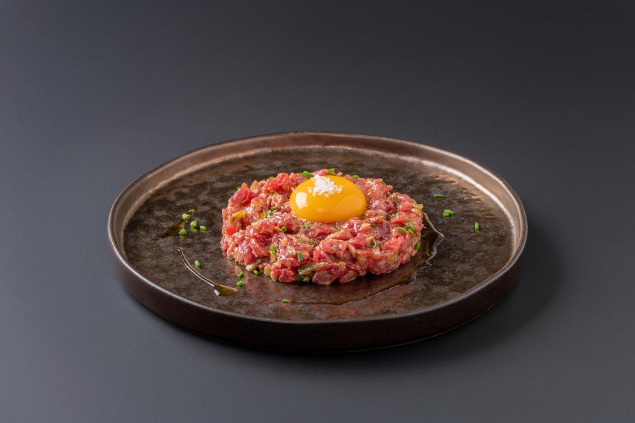 Eurostars Portico Alicante Exterior foto A plate of tartar